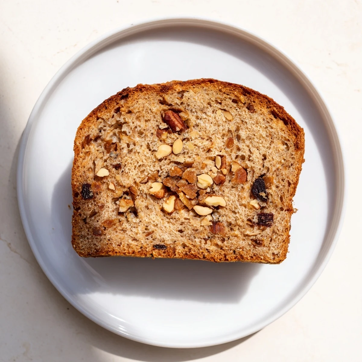 Warm, golden Nutty Whole Wheat Loaf Bread with a delicious crust, ready to slice and serve.