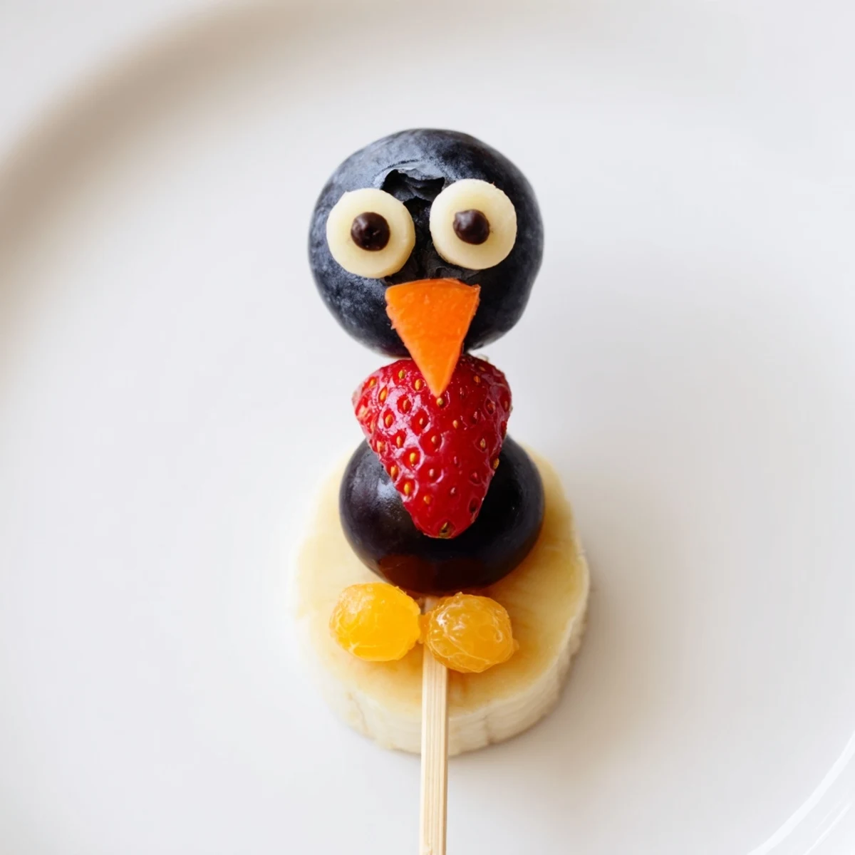 Creative Penguin Fruit Skewer Army displays colorful, fresh fruit arranged into charming penguin shapes, a fun snack idea.