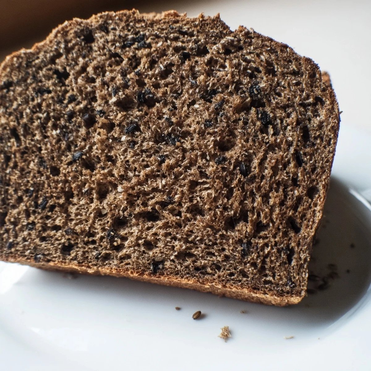 Freshly baked Estonian Leib Sourdough ready to be sliced, its rye aroma filling the kitchen.