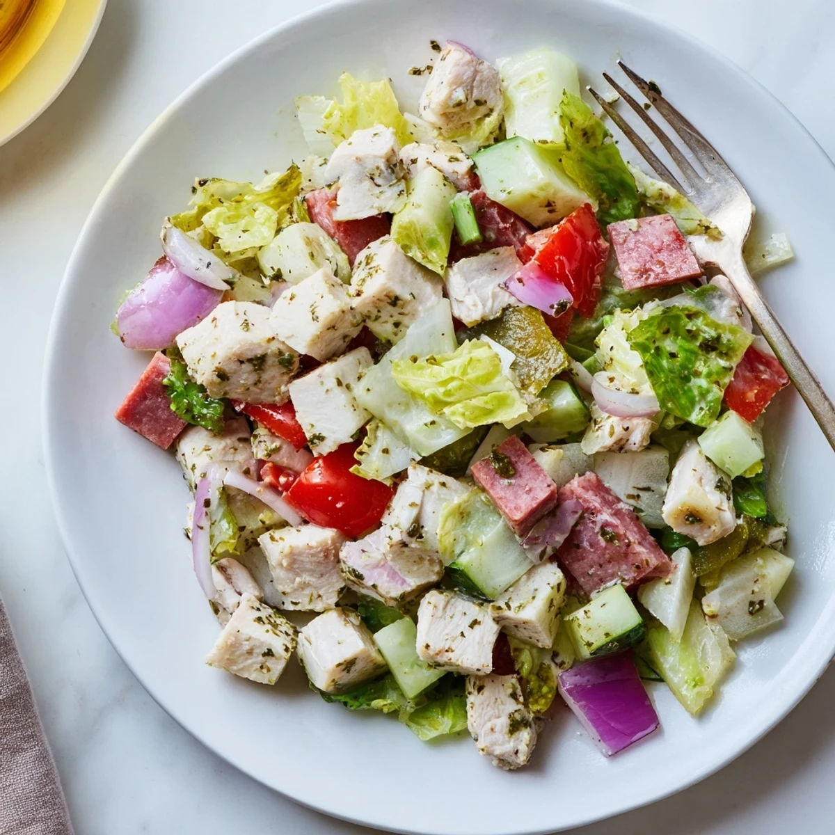 Italian Deli Chopped Chicken Salad served in a rustic bowl, ready for a hearty lunch with crusty bread on the side.  