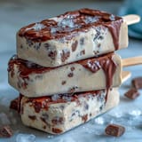 Vanilla Bean Frappuccino Fudge Pops: creamy frozen treats with a rich vanilla and coffee flavor, drizzled with smooth chocolate fudge for a refreshing dessert.