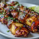 Tropical chicken skewers featuring tender chicken, sweet pineapple, and colorful bell peppers, grilled to smoky perfection.  