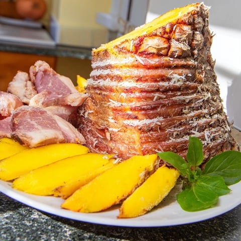 Fresh and colorful Tropical Pineapple Paradise fruit platter, filled with juicy, vibrant mango and berries.