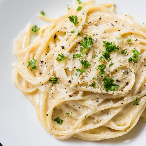 Creamy Pasta Alfredo Cottage Hack, made with smooth cheese, offers a comforting, rich flavor.