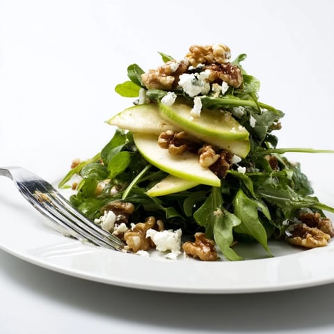 Crisp apple and walnut salad tossed with mixed greens, crumbled blue cheese, and a tangy apple cider vinaigrette.  