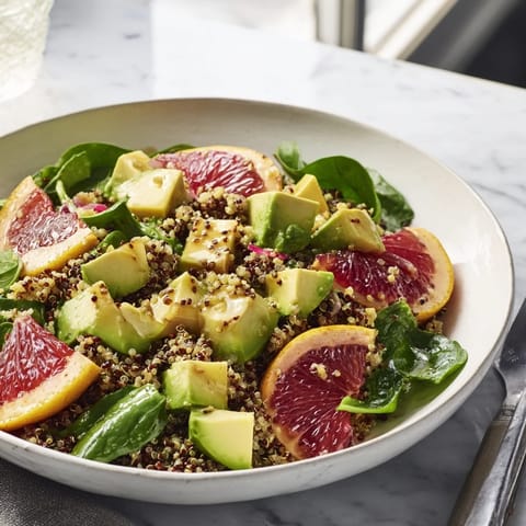 Bright and flavorful Fresh Citrus & Avocado Quinoa Bowl, ready to enjoy as a refreshing and healthy meal.