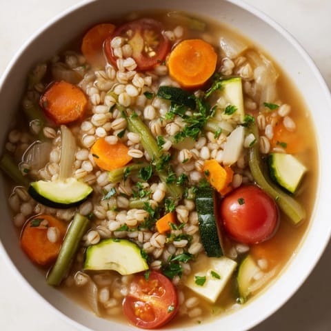 Delicious Simple Homemade Grain and Vegetable Soup, fragrant with herbs, ready to warm you up on a chilly day.