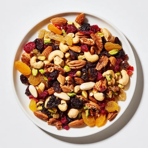 This inviting image shows a colorful mix of assorted nuts and dried fruit for your party.