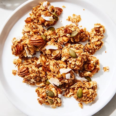 Homemade Honey Nut Granola Clusters with a rich aroma, ideal for a topping on yogurt or enjoying plain.