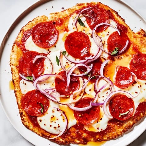 Spicy pepperoni baked on a crispy flatbread, finished with sweet hot honey, ready to eat!