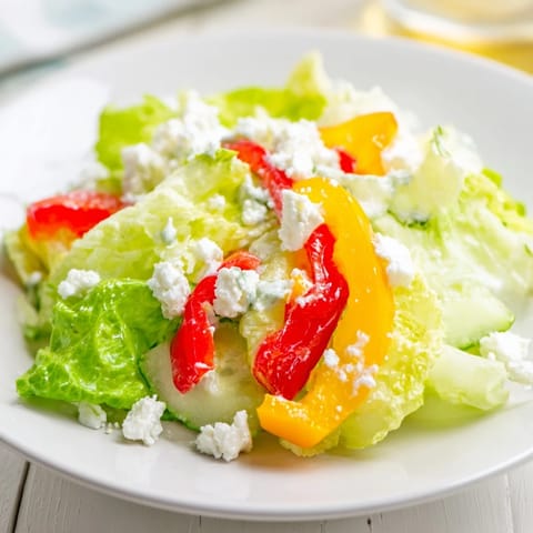 Fresh, vibrant Bella Hadid Salad with crunchy lettuce and a bright lemon dressing, perfect for lunch.