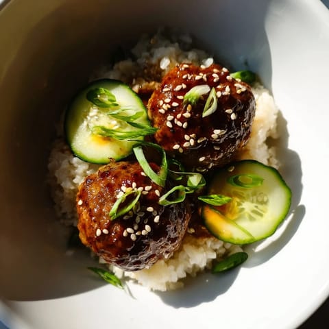 Shiny, glazed teriyaki meatballs atop fluffy rice in these colorful, fresh Teriyaki Meatball Bowls.
