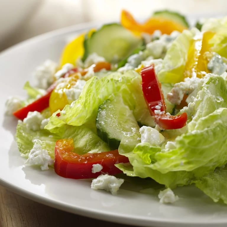 Imagine a refreshing bowl of Bella Hadid Salad: colorful, cool, and drizzled with a tangy vinaigrette.