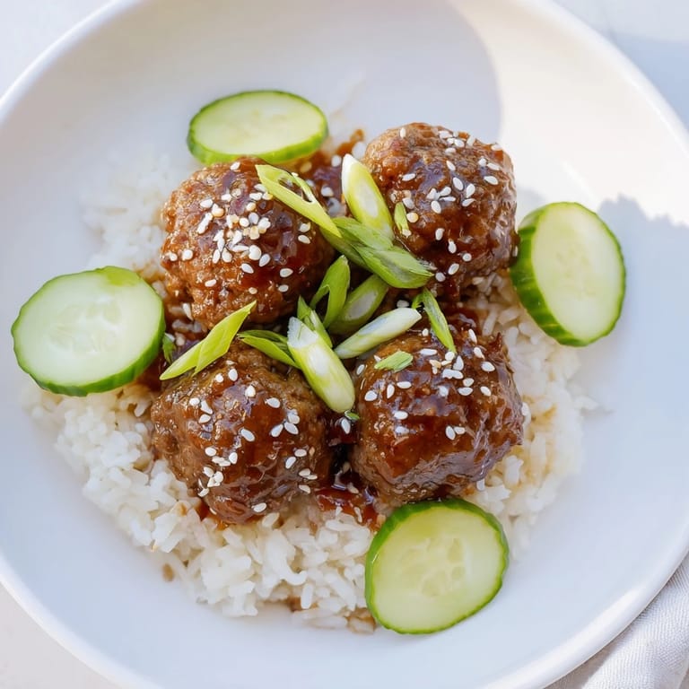 Savory teriyaki sauce coats juicy meatballs in these easy-to-make, satisfying Teriyaki Meatball Bowls.