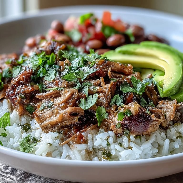 Topped with fresh salsa, sliced avocado, and chopped cilantro for a vibrant meal.