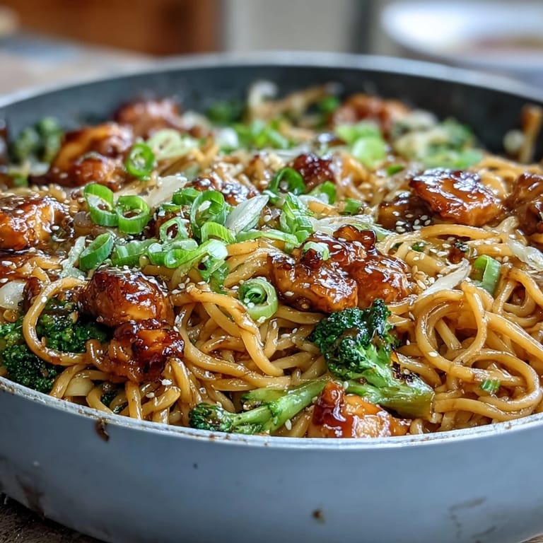 Bold garlic-honey glazed chicken and vegetables tossed with egg noodles for a flavorful Asian-inspired dinner.